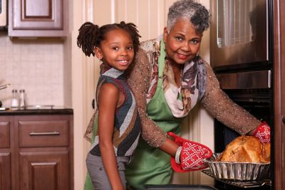 Woman teaching home safety tips to her daughter