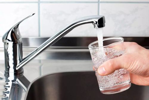 Homeowner Getting Water From Tap