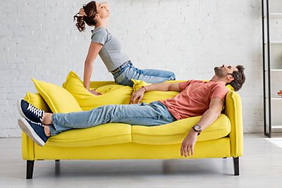 Couple enjoying the cool air on a sofa