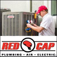 Red Cap HVAC tech repairing an air conditioning system at a home in Clearwater, FL