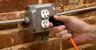 Man plugging the switch in the socket
