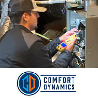 Comfort Dynamics tech repairing an HVAC system in a Lakeland, TN home