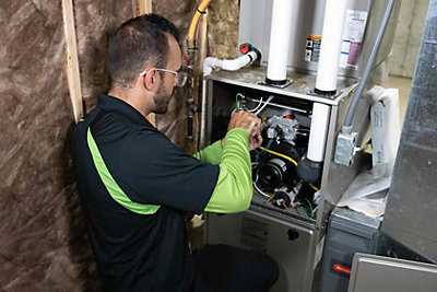 HVAC repair technician at furnace