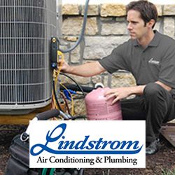 AC tech from Lindstrom repairing a cooling system