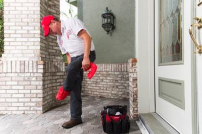 A person wearing red hat and white shirt <
