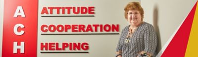 Ragsdale employee standing in front of company values on wall