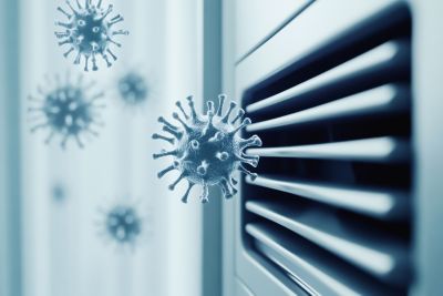 close-up of airborne viruses emerging from ventilation system, representing health risks and airborne transmission due to poor indoor air quality and ventilation issues