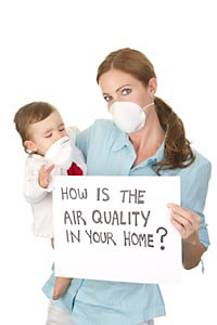 Women holding a card saying air quality