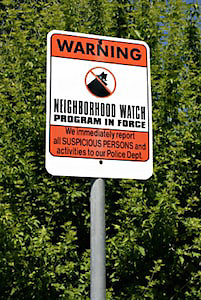 Sign warning about neighborhood watch