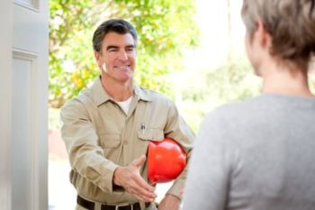 Technician shaking a hand to a women