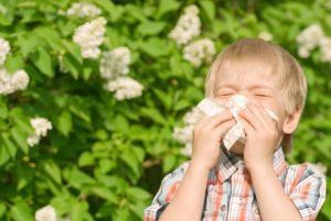 Boy sneezing