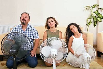 3 people blowing electric fans