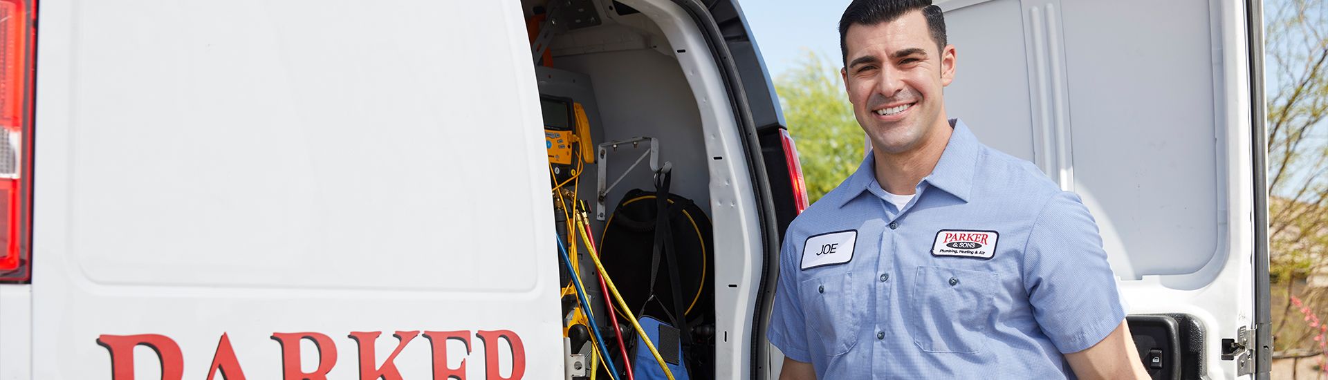 Technician repairing air conditioning unit