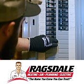 Electrician inspecting an electrical panel
