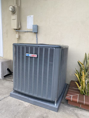 An AC unit connected to a building.