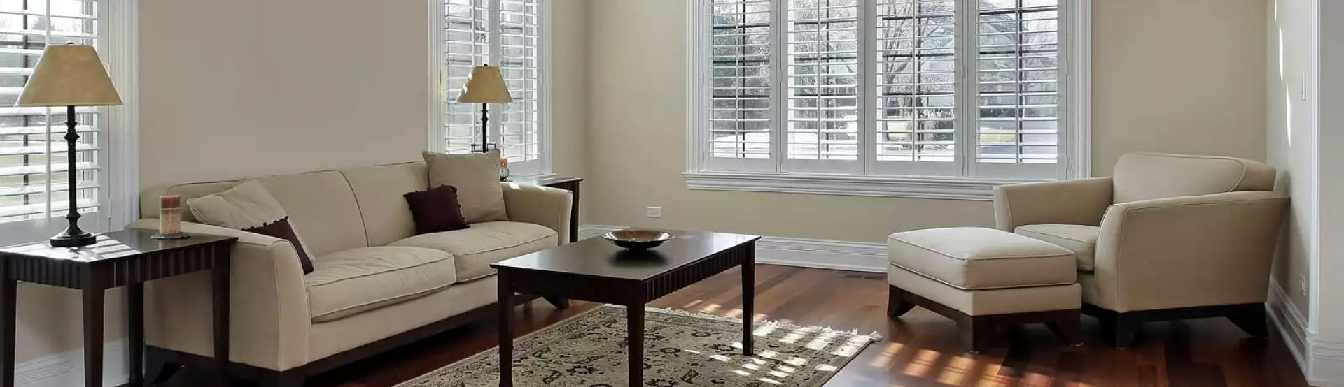 A living room filled with furniture and windows