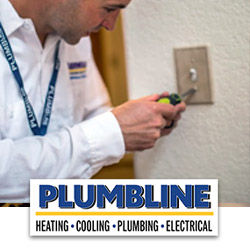 Electrician from Plumbline inspecting a light switch