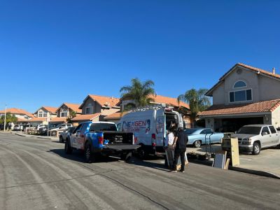 NexGen Truck and Van parked outside a house