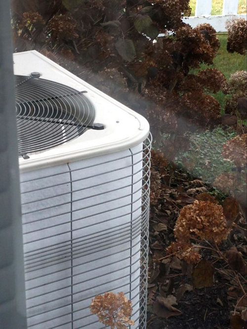 A white air conditioner outside