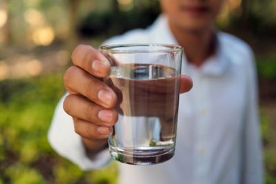 man holding a glass of water