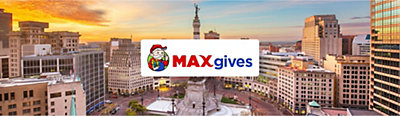 Max Gives logo with Indianapolis city view in background