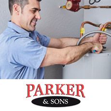 A plumber repairing a water heater