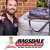 Ragsdale technician inspecting an HVAC system