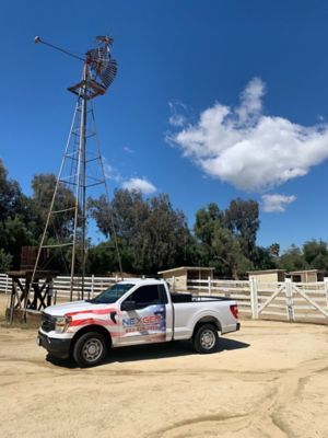 NexGen Truck parke in front of windmill