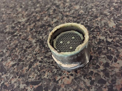Mineral deposits on a sink faucet aerator