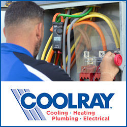 A Coolray electrician inspecting an electrical panel