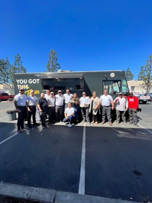 NexGen Employees stading in front of a taco truck