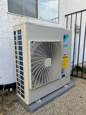 A Daikin Ductless Unit connected to a home.