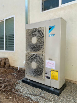 A Daikin Ductless Unit connected to a home.