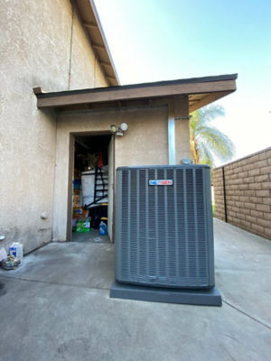 An AC unit connected to a building.