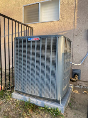 An AC unit connected to a building.