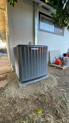 An AC unit connected to a building.