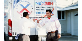 Two NexGen Techs at the back of a work van giving each other a fist bump