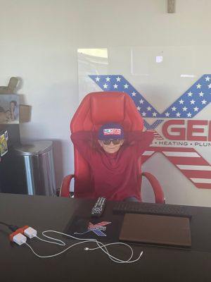 Kid sitting in chair at NexGen office