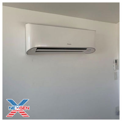 A mini split ac unit mounted on a wall.