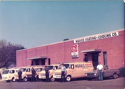 Vintage Morris-Jenkins building with trucks and VW truck at the end