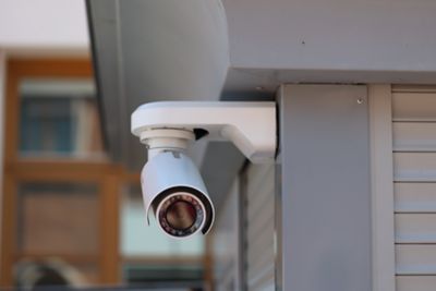Security camera installed on home outdoors