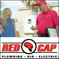 Red Cap electrician discussing outdoor lighting with a homeowner