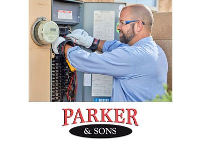 Electrician checking wiring in an electrical panel