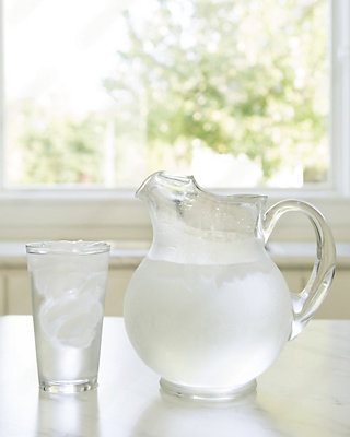 A pitcher and a glass of water on a table - Thomas & Galbraith