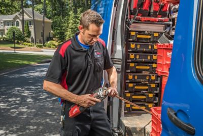 Plumber preparing to perform hydro jetting drain clearing services in an Atlanta area home