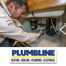 A plumber in Erie, CO fixing a kitchen sink drain