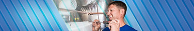 Plumber repairing a water heater in a Leeds, AL home