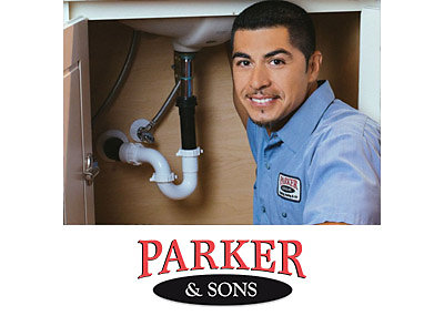 A plumber in a Gilbert, AZ home, repairing a sink drain