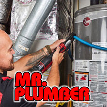 Plumber repairing a water heater