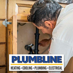 A plumber repairing a bathroom sink drain in Lafayette, CO